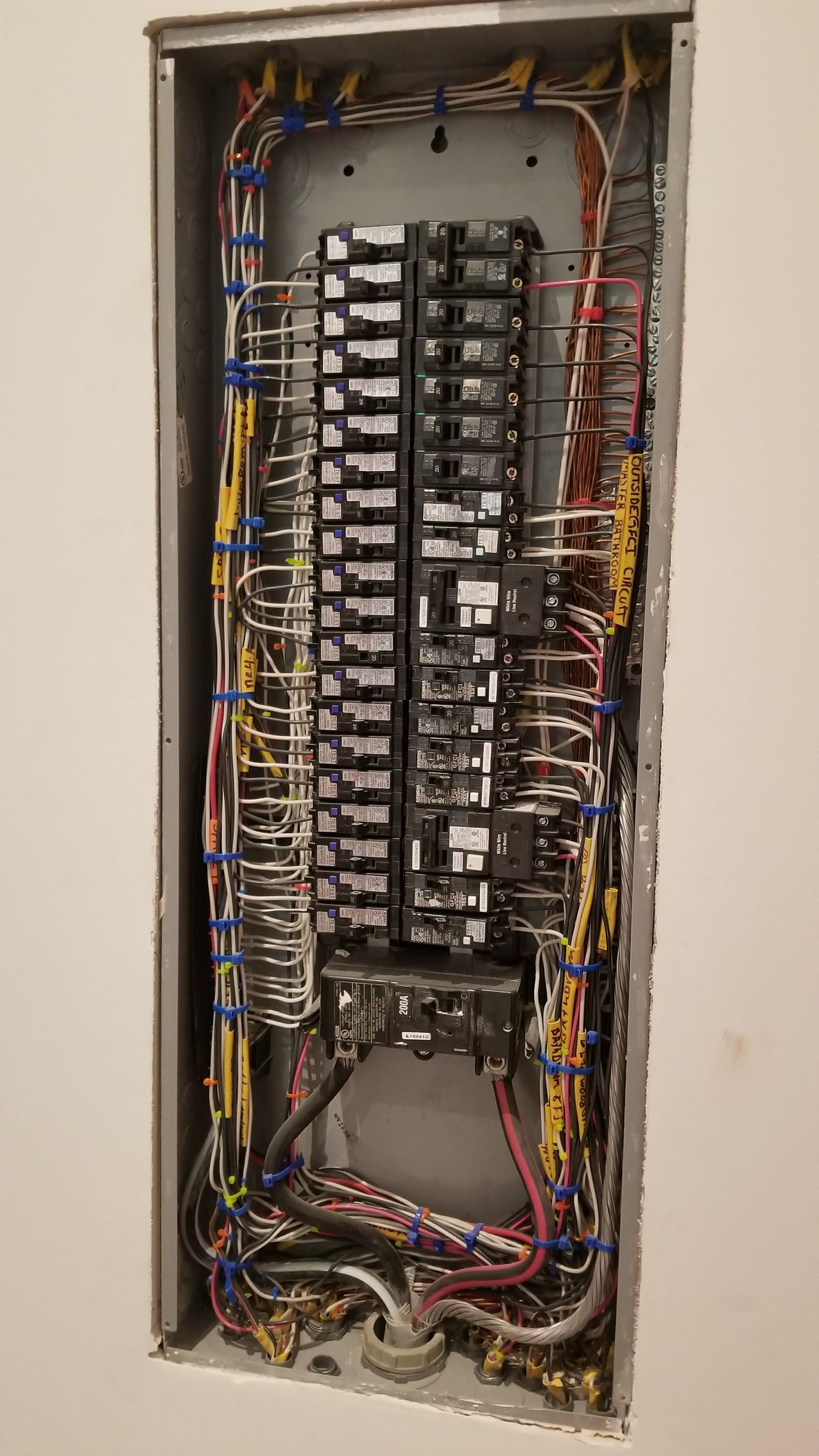 A very large electrical box with a lot of wires coming out of it.