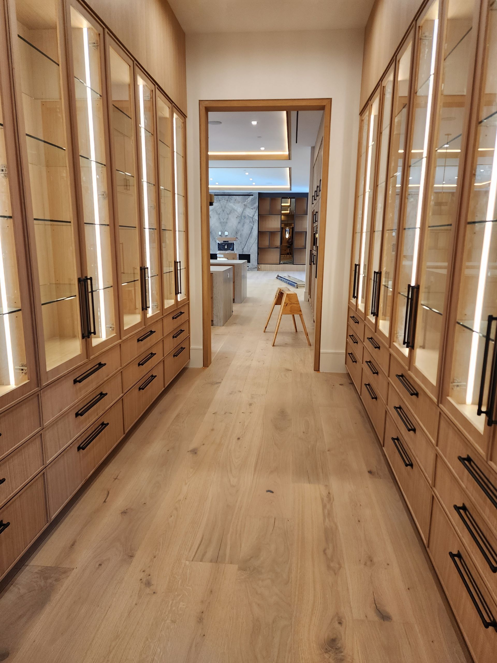 A kitchen with stainless steel appliances and wooden cabinets