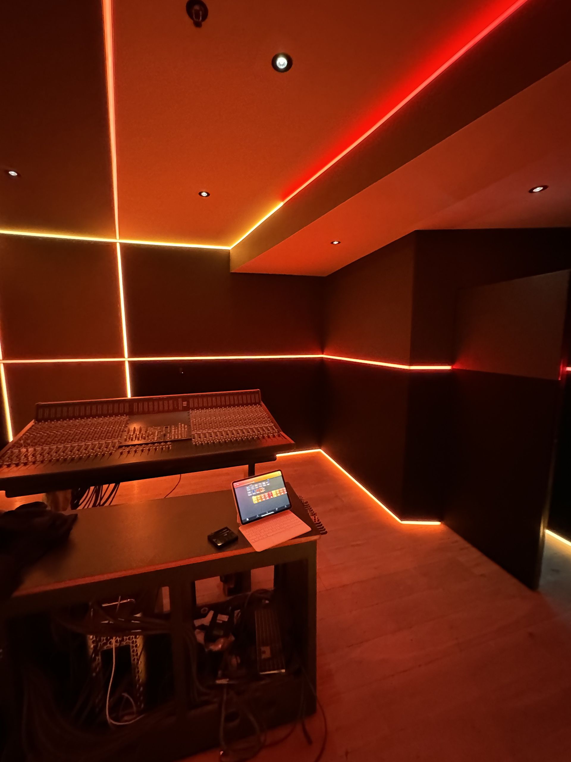 A room with a desk and a laptop on it