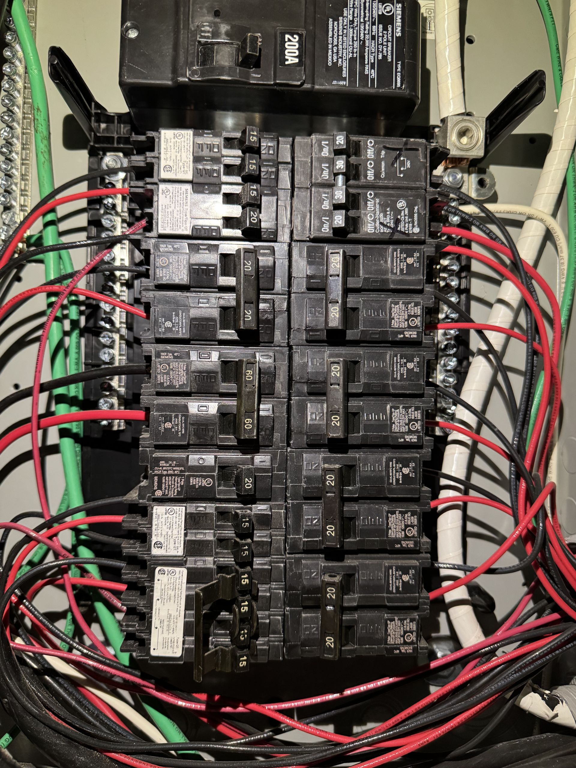 A electrical box with a lot of wires coming out of it