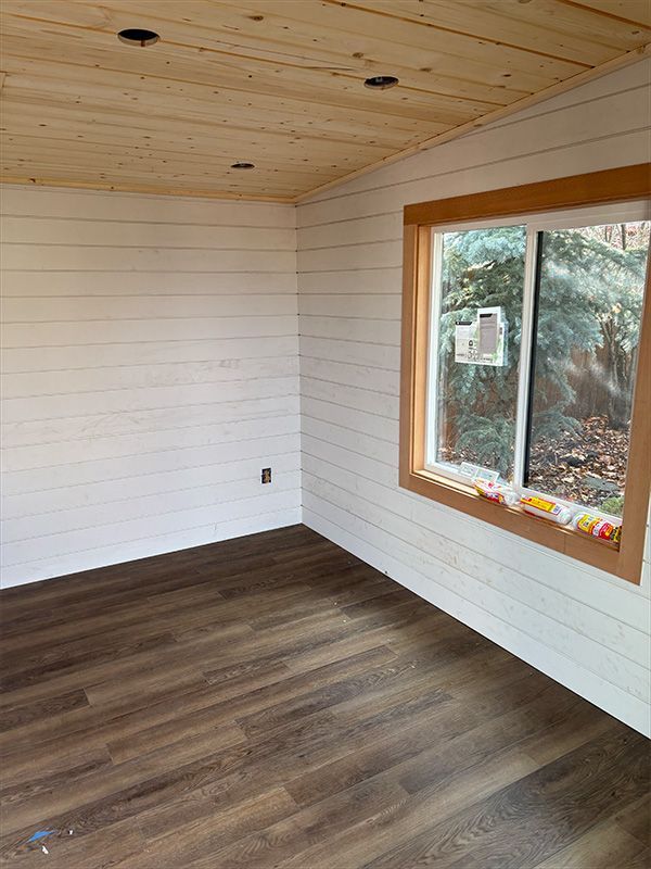 A small wooden house with sliding glass doors