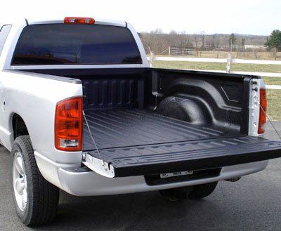 A silver pickup truck with a black truck bed liner