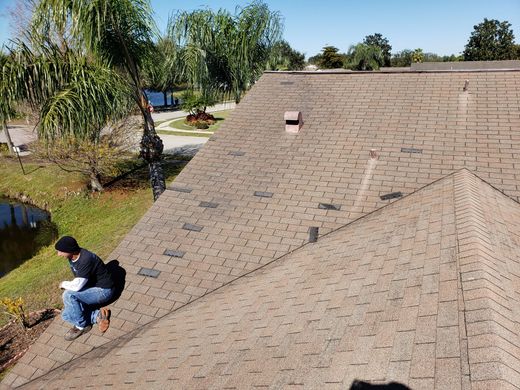 hand pulling at roof piece