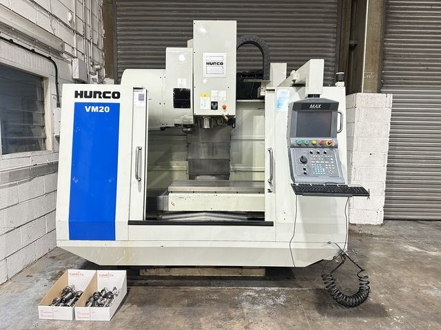 A machine with a sign on it that says machining intelligently.