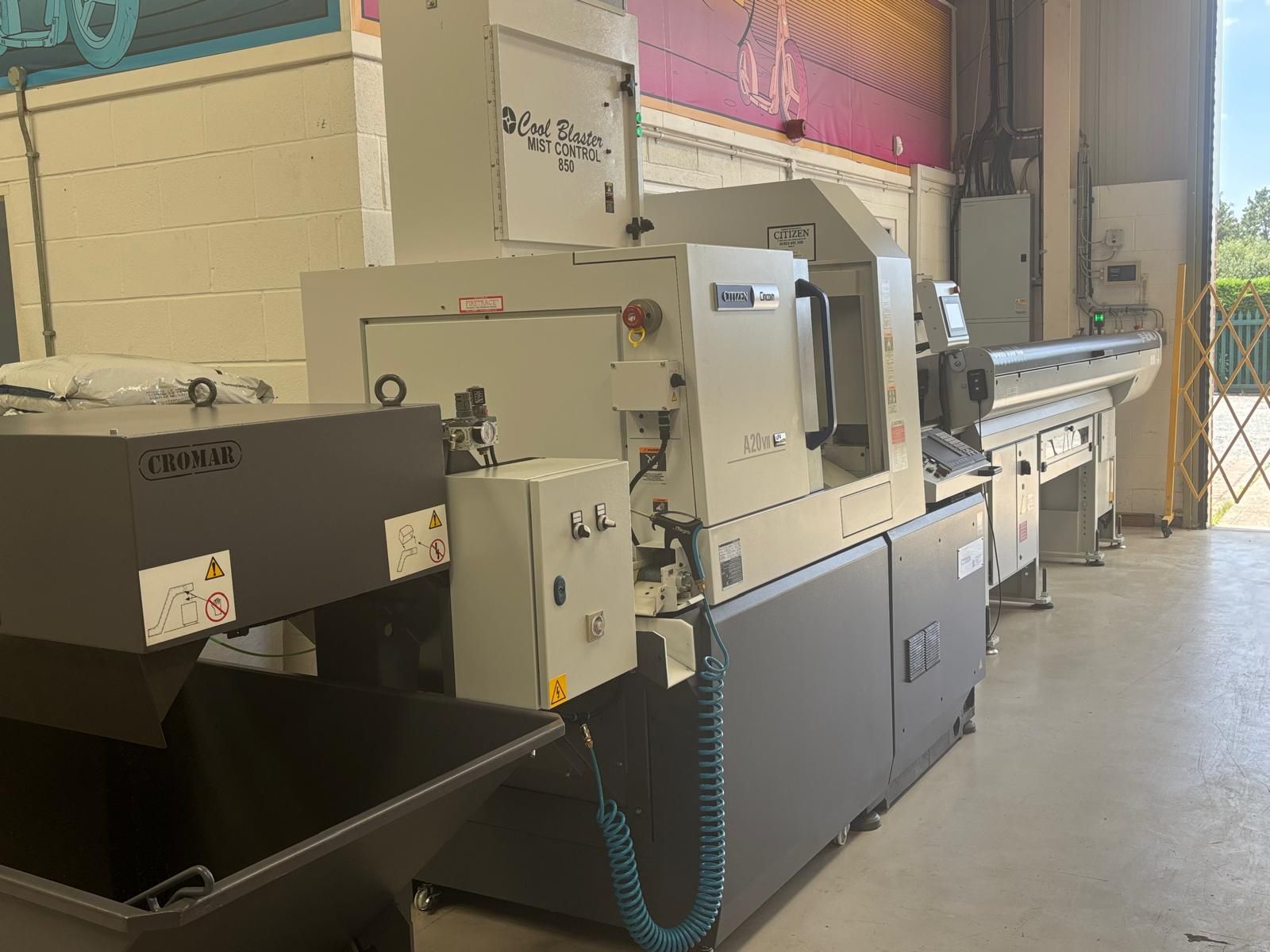 A machine is sitting on a table in a factory.