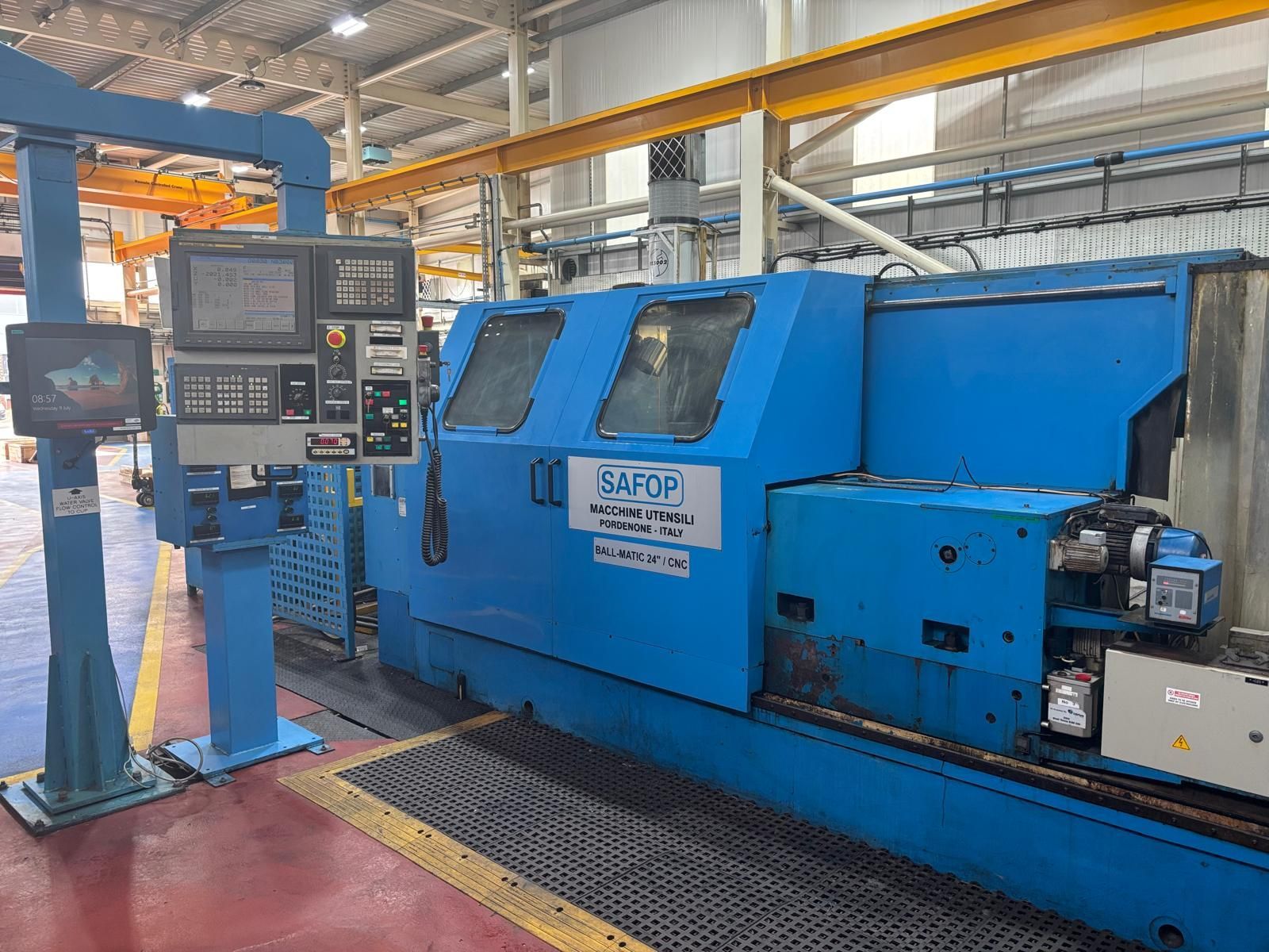 A machine is sitting on a table in a factory.