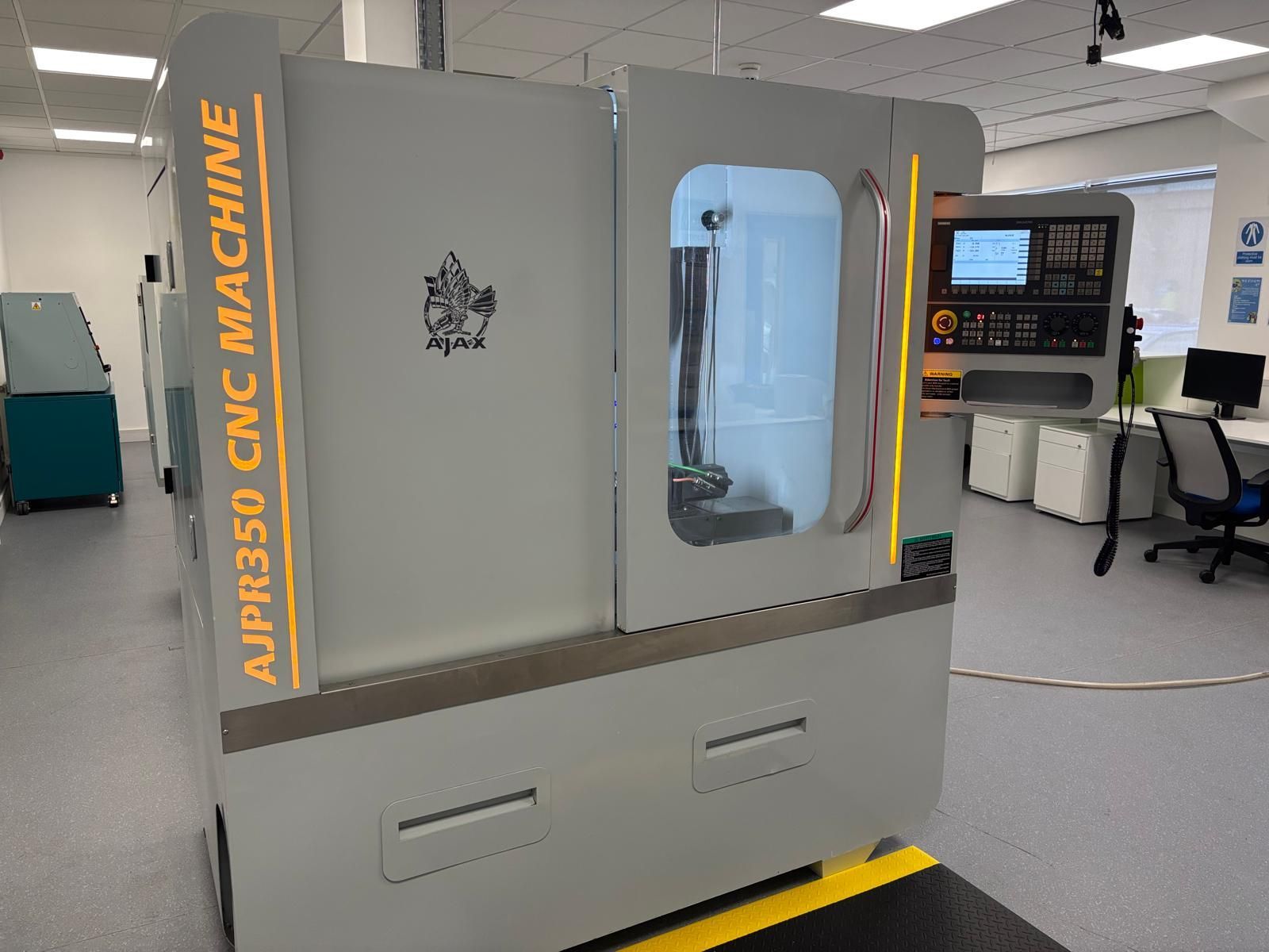 A large machine is sitting in a factory.