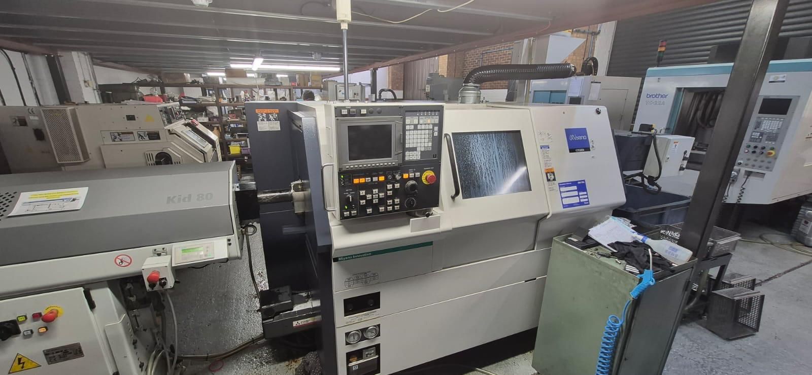 A machine with a sign on it that says machining intelligently.
