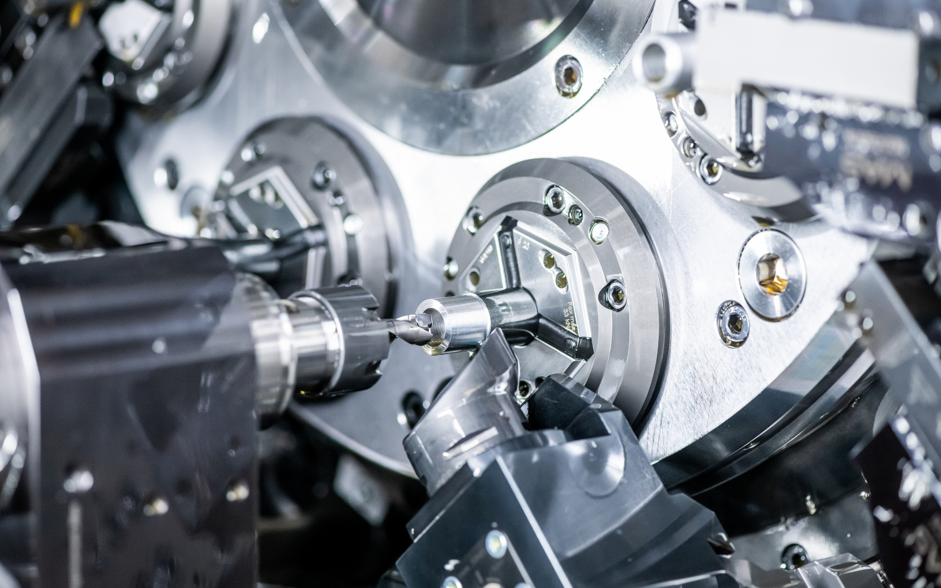 A machine is cutting a piece of metal in a factory.