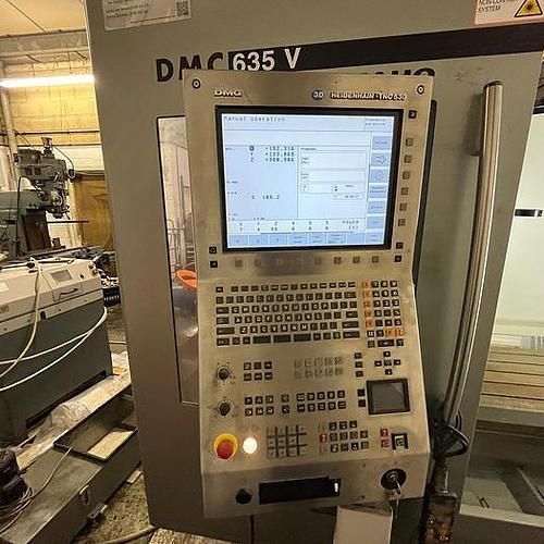 A machine with a monitor and a keyboard on it.