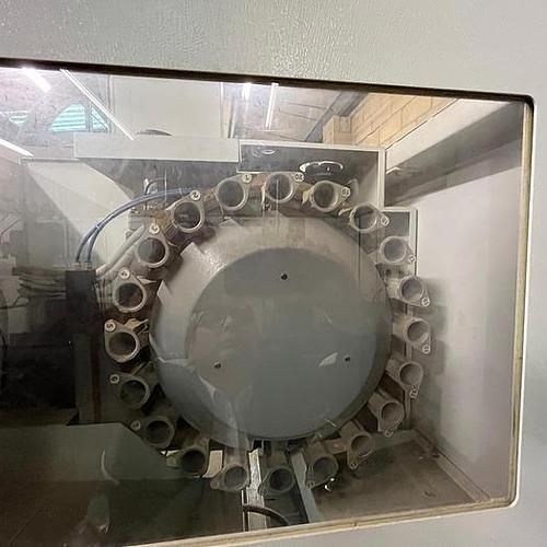 A machine is sitting inside of a glass case.