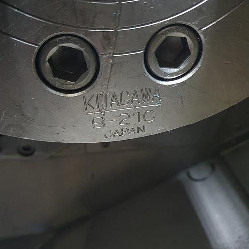 A close up of a metal object with two holes in it.