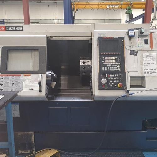 A machine is sitting on a table in a factory.