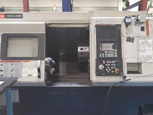 A machine is sitting on a table in a factory.