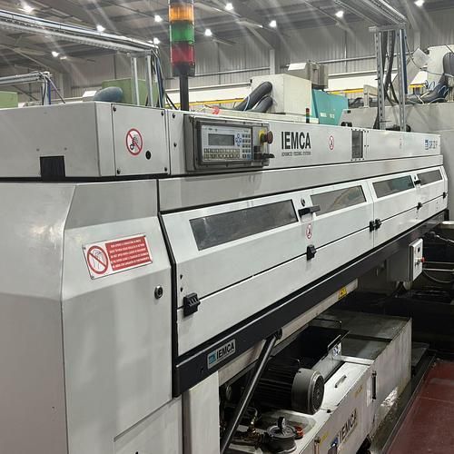 A large machine is sitting in a factory.