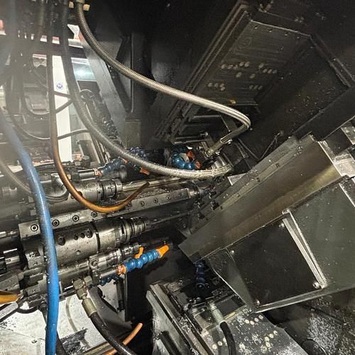 A close up of a machine with a lot of wires coming out of it.