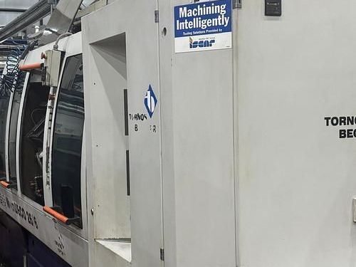 A machine with a sign on it that says machining intelligently.