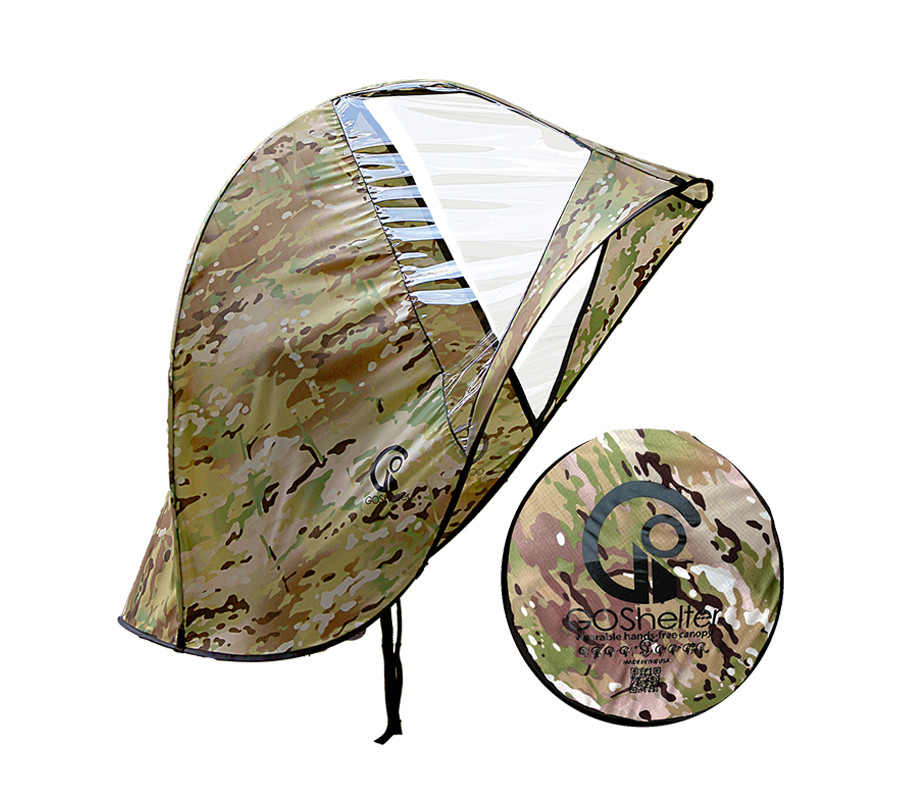 MultiCam® camouflage  GOShelter Wearable Hands-Free Canopy for rain protection and sunshade with clear windows open and folded next to a disc with the brand logo.