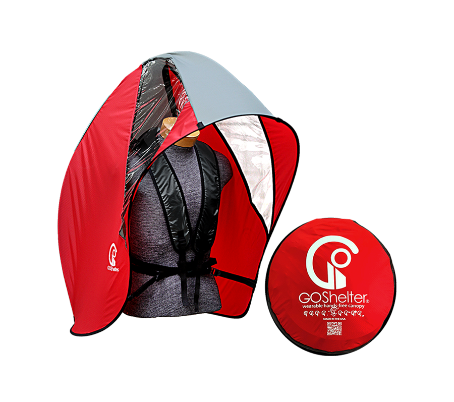 Red and gray GOShelter Wearable Hands-Free Canopy for rain protection and sunshade with mannequin inside and a folded matching disc nearby.