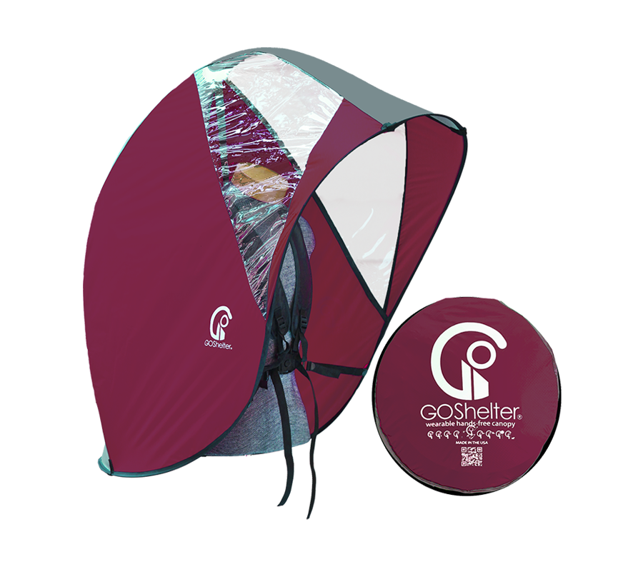 Maroon GOShelter Wearable Hands-Free Canopy for rain protection and sunshade next to a circular storage case.