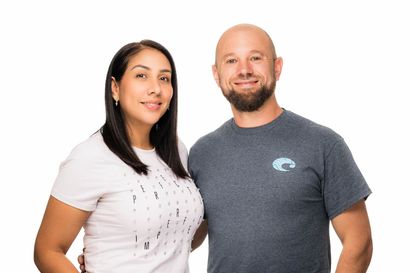 A man and a woman are posing for a picture together.