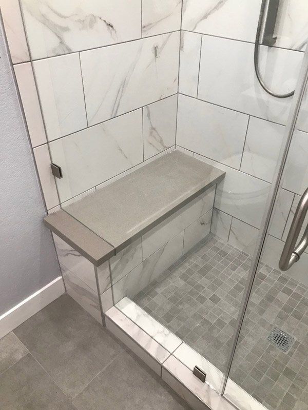 Bathroom Design — Bathroom With Clear Glass Door Ceramic Chair View in La Habra, CA