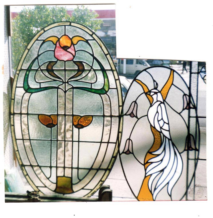 2 oval leadlights of flower and white bird