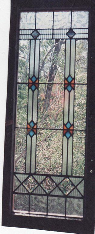 rectangular window design with trees behind it