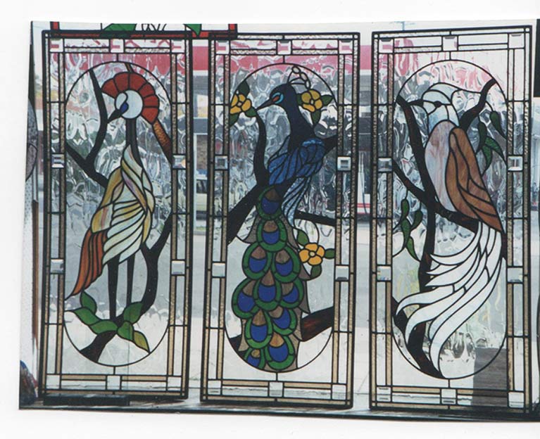 three panel leadlight window with three different intricate bird designs