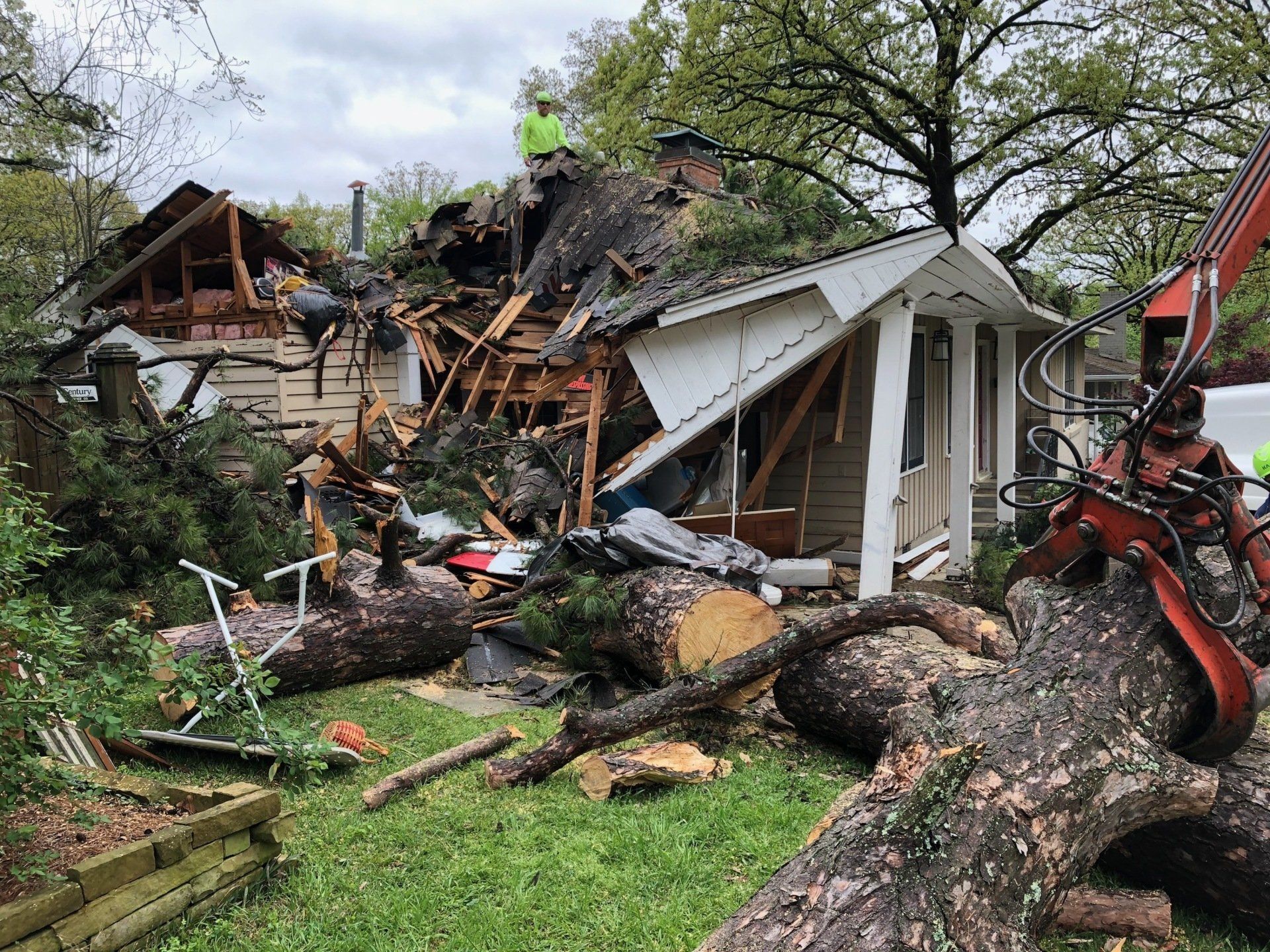 Big tree fallen on residential home in Arkansas after thunderstorms with high wind