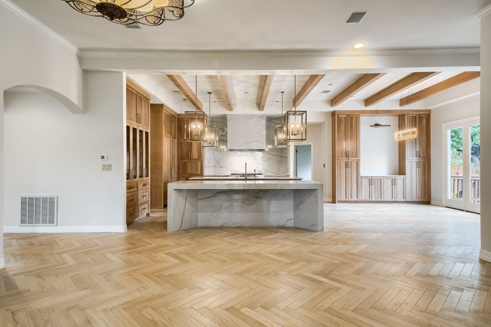 A spacious kitchen with a granite countertop