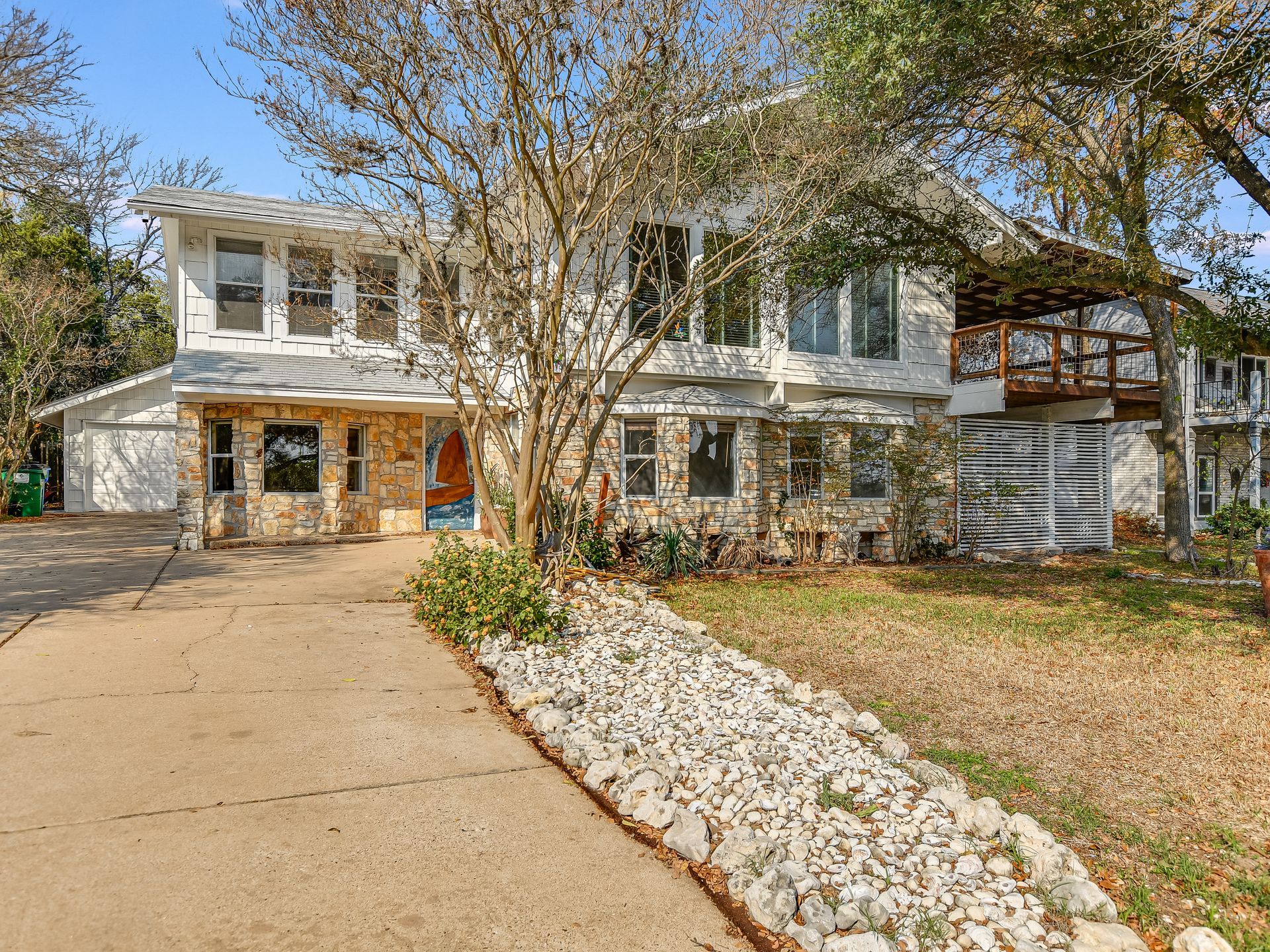 Home exterior, attached garage, and a lovely garden in Texas