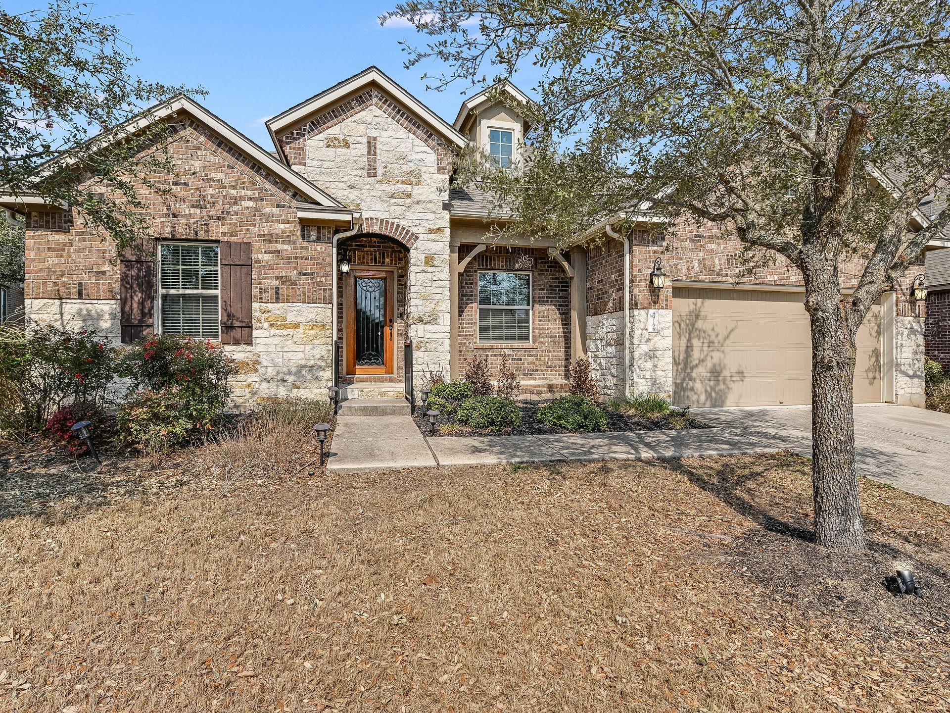 HOA Property exterior with attached garage