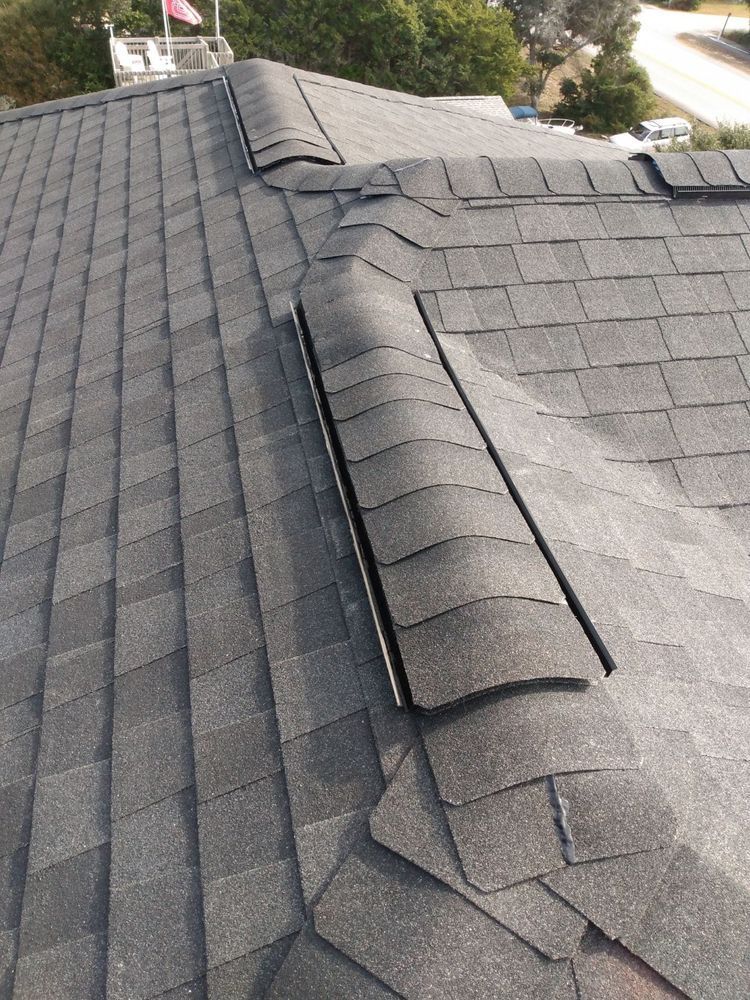 A close up of a roof with shingles on it.