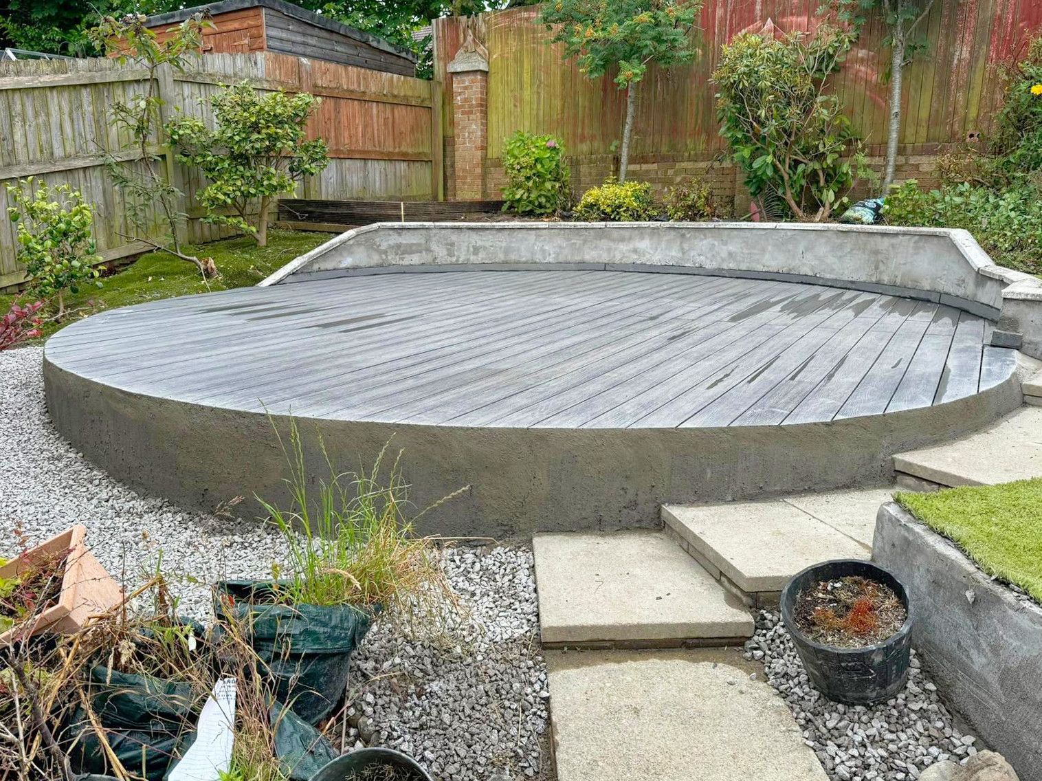 There is a large circular area in the middle of the garden.