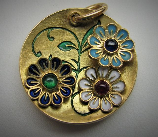 ciondolo d'oro tondo con fiorellini colorati