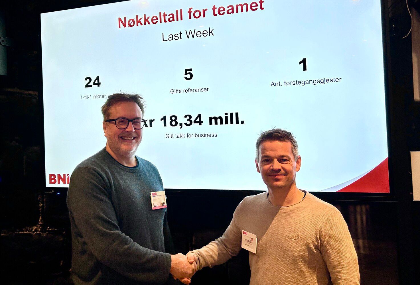 Hands being washed under running water with soap.