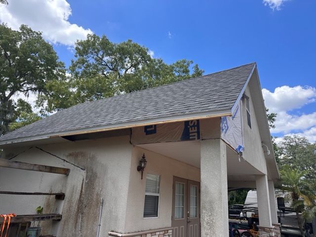 A house with a roof that is being remodeled.