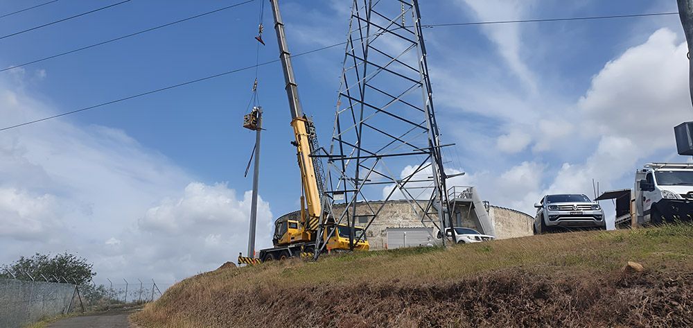 Retaining wall blocks with excavator — Landscaper in Deeragun QLD