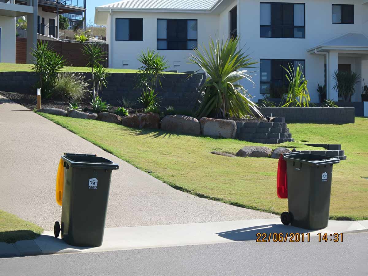House With Front Landscape And Two Garbage Bins — Austen Landscaping & Earthmoving in Deeragun, QLD