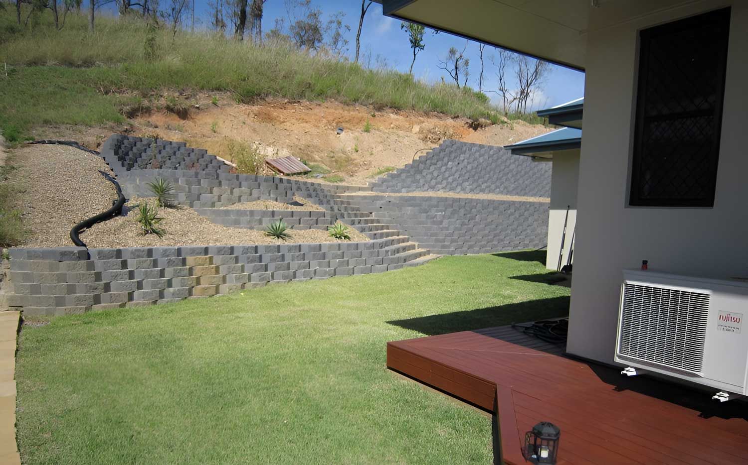 A House With A Large Lawn In Front Of It — Austen Landscaping & Earthmoving in Deeragun, QLD