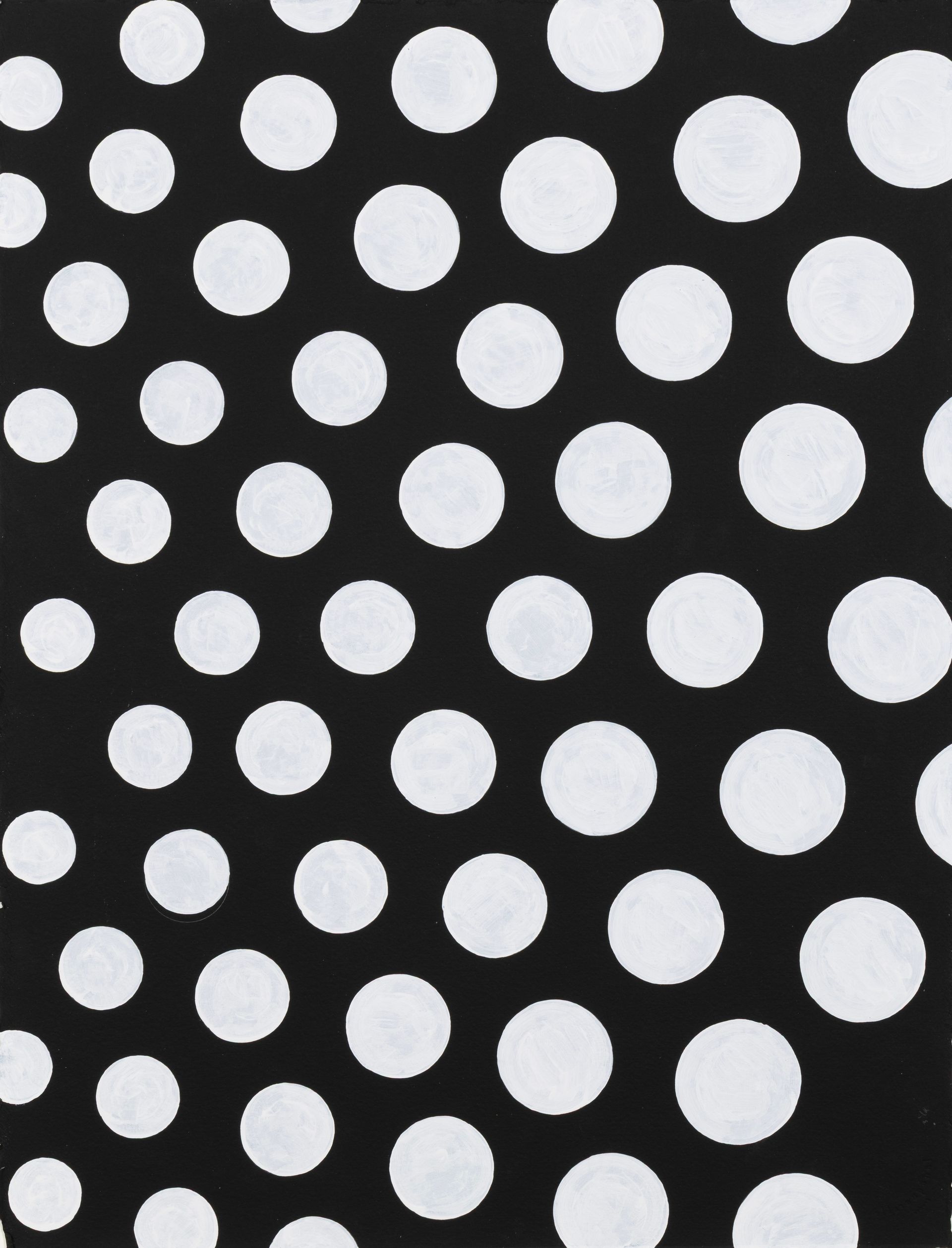 Black fabric with large white polka dots patterned diagonally across the frame
