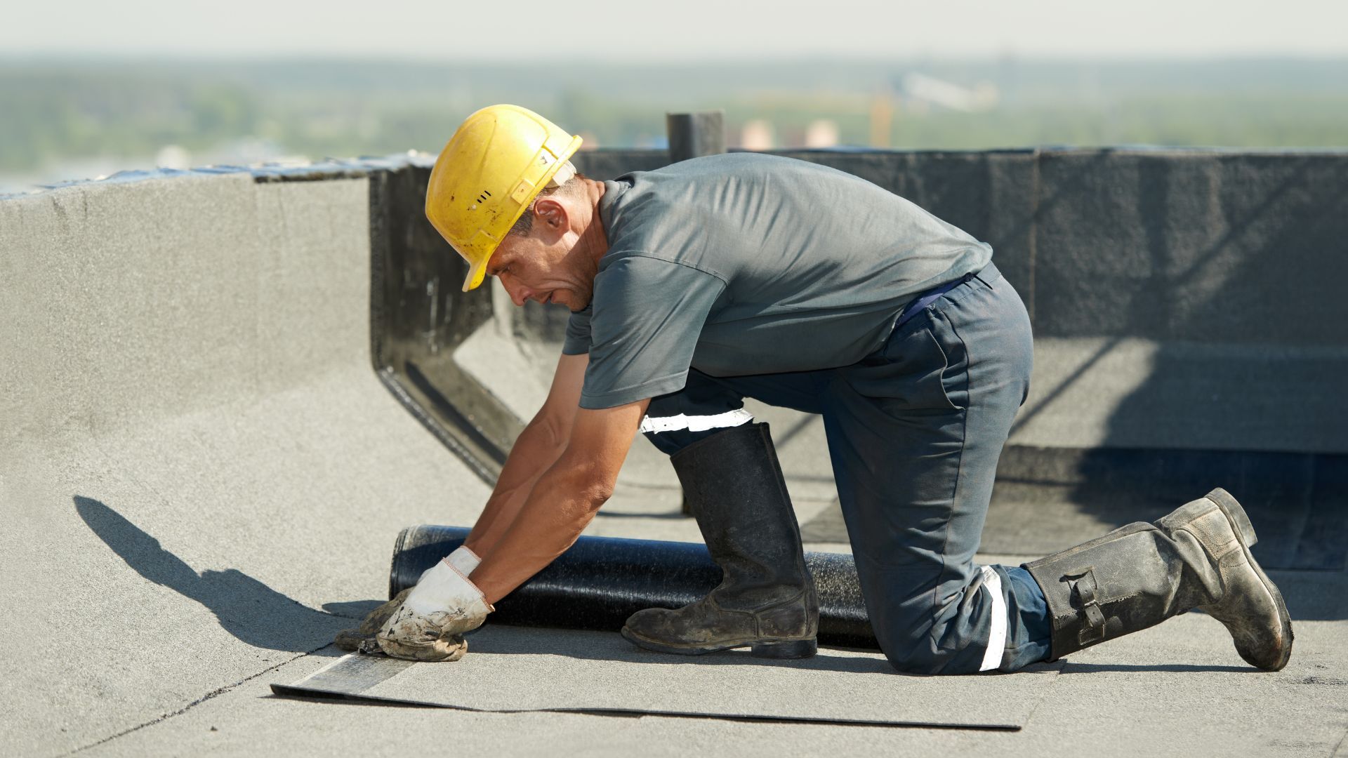 View of commercial roofer working on roof