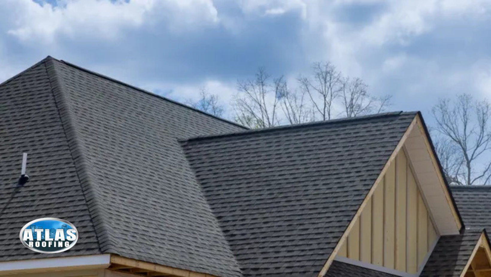 A roof of a house with a blue sky in the background.