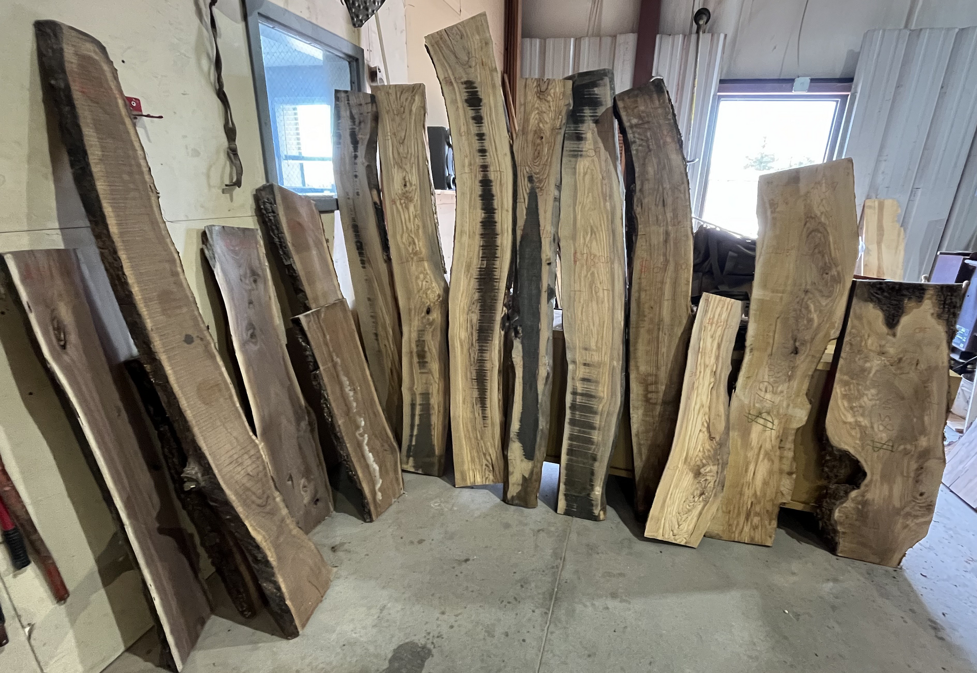 A bunch of wood pieces are sitting on the floor in a room.