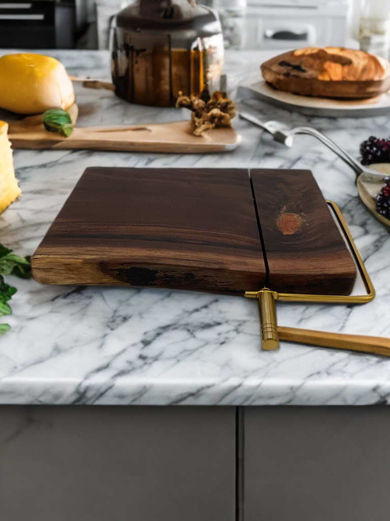 A wooden cutting board is sitting on top of a marble counter.