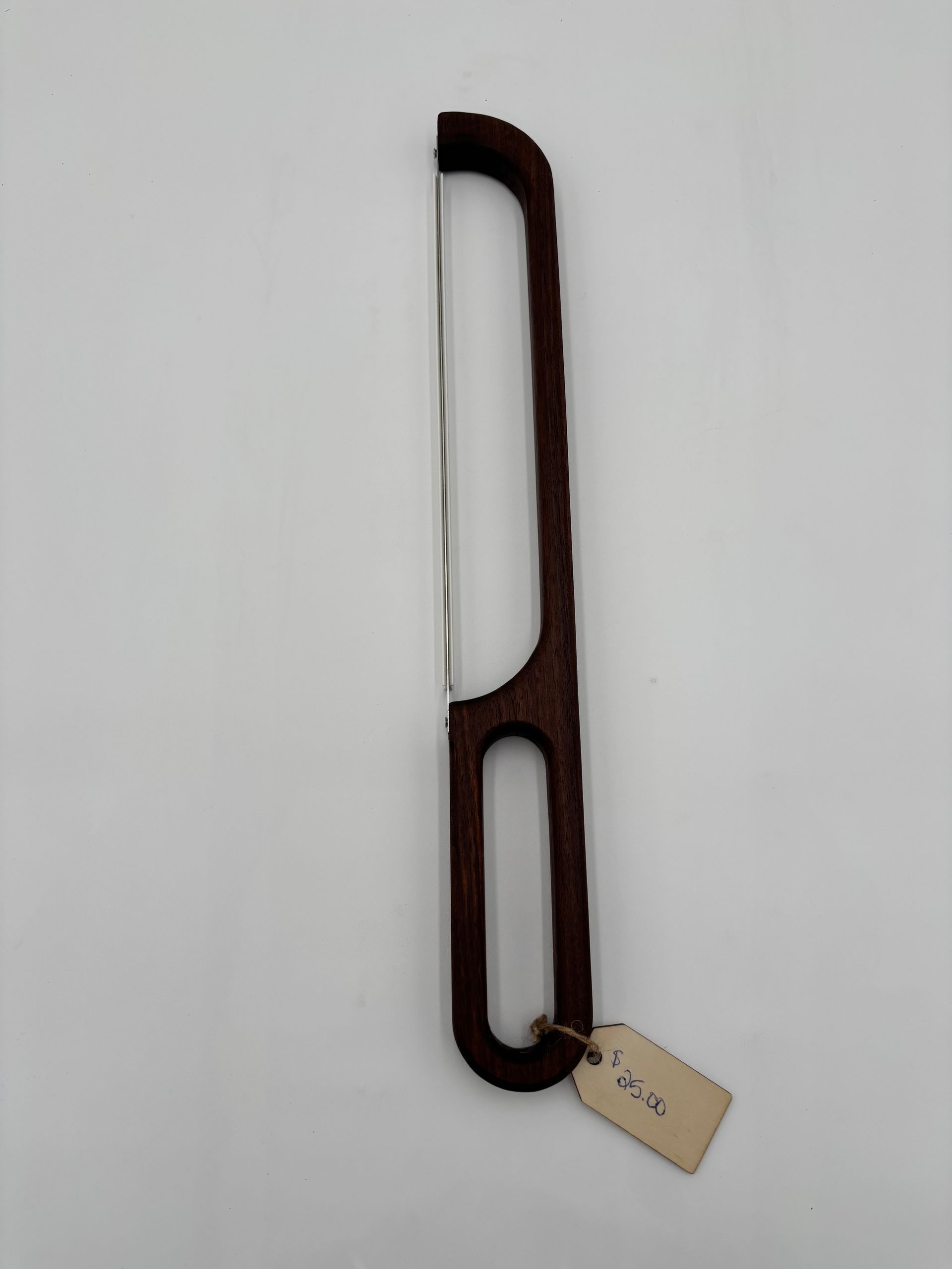 Brown bread knife with thin wire blade.