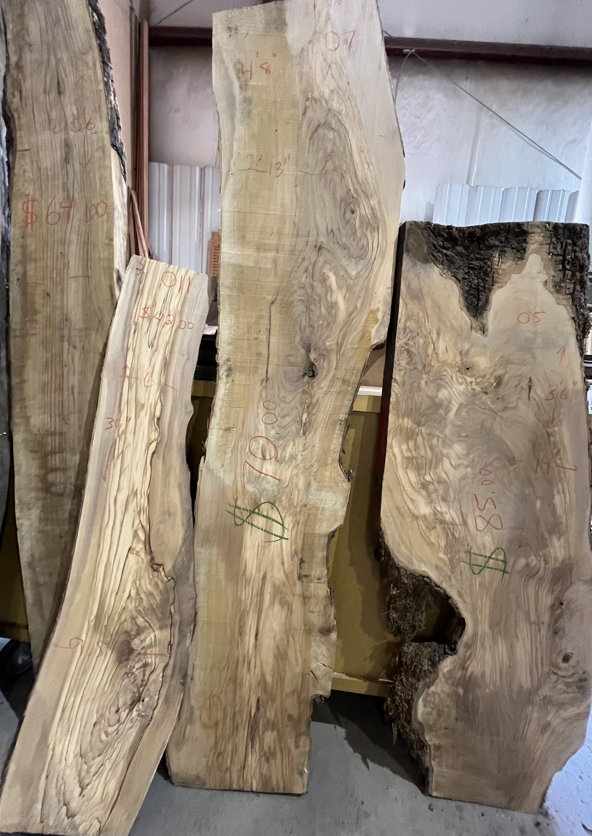 A bunch of wood pieces sitting on top of each other in a room.