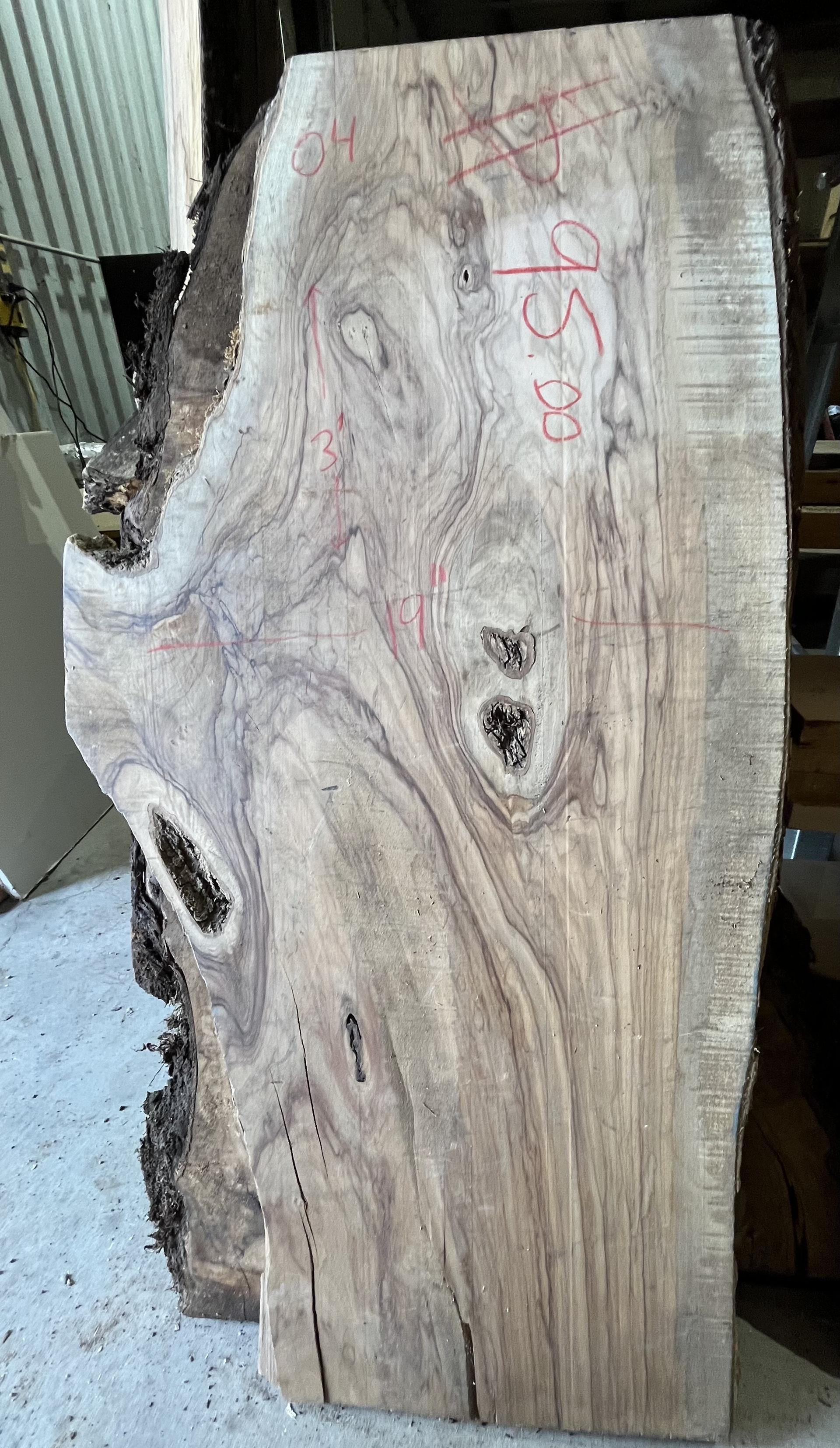 A large piece of wood is sitting on top of a table.