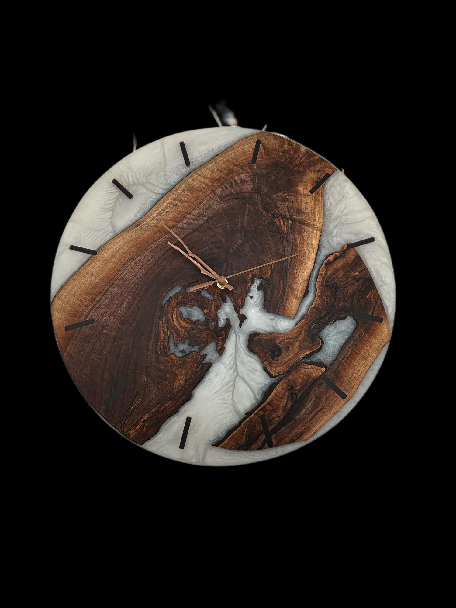 Round wall clock with brown wood and white resin inlay, black hands and markers